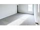 Bright bedroom featuring carpeted flooring and a window at 5342 Legacy Trl, Douglasville, GA 30135