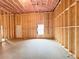 Unfinished basement featuring exposed framing, insulation, and a single window at 5547 Bent Grass Way, Douglasville, GA 30135