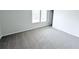Bright bedroom with carpeted floors and natural light from a window at 5547 Bent Grass Way, Douglasville, GA 30135