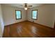 Cozy bedroom with hardwood floors, natural light, and ceiling fan at 5760 Brenda Sw Dr, Mableton, GA 30126