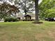 Charming single-story home with a welcoming front yard, carport, and landscaped garden at 5760 Brenda Sw Dr, Mableton, GA 30126