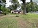 Inviting single-story home featuring a well-maintained front yard and charming landscaping at 5760 Brenda Sw Dr, Mableton, GA 30126