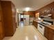 Functional kitchen with ample cabinet space, tile floors, and modern appliances at 5760 Brenda Sw Dr, Mableton, GA 30126