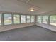 Bright sunroom with many windows offering nice views and comfortable carpet at 5760 Brenda Sw Dr, Mableton, GA 30126