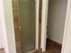 Modern bathroom featuring a glass-enclosed shower and a separate toilet room at 6848 Timberhead Way, Lithonia, GA 30058