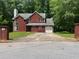 Charming two-story brick home with a well-maintained front yard and a spacious driveway at 6848 Timberhead Way, Lithonia, GA 30058
