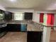 Kitchen boasts updated countertops, stainless steel appliances, and tile backsplash at 6848 Timberhead Way, Lithonia, GA 30058