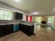 Open concept kitchen and living room with eat-in bar at 6848 Timberhead Way, Lithonia, GA 30058