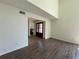 Inviting living room featuring hard wood floors, tall ceilings and a view into a half bathroom at 6848 Timberhead Way, Lithonia, GA 30058