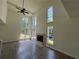 View of the bright living room with a cozy fireplace and many windows at 6848 Timberhead Way, Lithonia, GA 30058