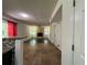 Living room features a stone fireplace and seamless flow from the kitchen at 6848 Timberhead Way, Lithonia, GA 30058
