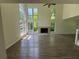 Bright, airy living room with hardwood floors, fireplace, and many large windows at 6848 Timberhead Way, Lithonia, GA 30058