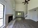 Spacious living area with tall ceilings, fireplace, and large windows at 6848 Timberhead Way, Lithonia, GA 30058