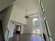 Bright living room featuring hardwood floors, soaring ceilings and large windows at 6848 Timberhead Way, Lithonia, GA 30058