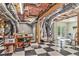 Large unfinished basement with utility connections and a checkered floor at 8901 Watkins Mill Rd, Winston, GA 30187