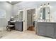 Elegant bathroom with dual vanities, neutral tile, and plenty of natural light at 8901 Watkins Mill Rd, Winston, GA 30187