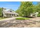 A beautiful, sprawling home with a circular driveway and lush landscaping creating an inviting outdoor space at 8901 Watkins Mill Rd, Winston, GA 30187