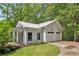 Exterior view of the detached two-car garage with white siding and matching trim at 8901 Watkins Mill Rd, Winston, GA 30187