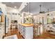 Open concept kitchen featuring a large island, open floor plan, and hardwood floors at 8901 Watkins Mill Rd, Winston, GA 30187