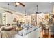 Open-concept living area features hardwood floors and ample seating, flowing into the kitchen and dining spaces at 8901 Watkins Mill Rd, Winston, GA 30187