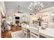 Open concept living space with a kitchen, dining area, and living room, all featuring hardwood floors at 8901 Watkins Mill Rd, Winston, GA 30187
