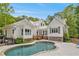 Back exterior of house featuring a private swimming pool and lounge area at 8901 Watkins Mill Rd, Winston, GA 30187