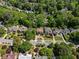 Scenic aerial view of the neighborhood, landscaped yards, and mature trees along the street at 1216 E Rock Springs Ne Rd, Atlanta, GA 30306