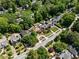 Scenic aerial view of the neighborhood, landscaped yards, and mature trees along the street at 1216 E Rock Springs Ne Rd, Atlanta, GA 30306
