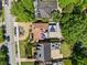 Expansive aerial view of the property with beautiful green trees and landscaping, a rooftop patio, and a driveway at 1216 E Rock Springs Ne Rd, Atlanta, GA 30306
