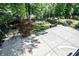 View of the fenced-in backyard with a concrete patio and lush lawn at 1216 E Rock Springs Ne Rd, Atlanta, GA 30306