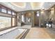 Luxurious bathroom with soaking tub, stone accents, natural light and a glass-enclosed shower at 1216 E Rock Springs Ne Rd, Atlanta, GA 30306