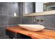 Bathroom sink with wood countertop and gray tiling at 1216 E Rock Springs Ne Rd, Atlanta, GA 30306