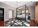 Well-appointed bedroom with a four-poster bed, closet, and ample natural light, creating a comfortable haven at 1216 E Rock Springs Ne Rd, Atlanta, GA 30306