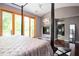 Bedroom boasts a four-poster bed, fireplace, and en-suite bathroom, offering luxury and comfort at 1216 E Rock Springs Ne Rd, Atlanta, GA 30306