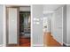 Walk-in closet with custom organizers, sliding doors, and hardwood floors at 1216 E Rock Springs Ne Rd, Atlanta, GA 30306