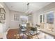 Bright dining room boasts modern lighting, hardwood floors, and a view of the outdoors at 1216 E Rock Springs Ne Rd, Atlanta, GA 30306