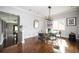 Bright dining room featuring hardwood floors, modern chandelier, and views of the backyard at 1216 E Rock Springs Ne Rd, Atlanta, GA 30306