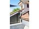 Exterior of the home featuring a turret, tiled roof, gray storage, and light-filled balcony at 1216 E Rock Springs Ne Rd, Atlanta, GA 30306