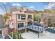 An exterior view of the home showcasing its deck, patio, roof deck, and unique architectural features at 1216 E Rock Springs Ne Rd, Atlanta, GA 30306