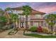 Striking two-story home with mature landscaping and a sunset sky, adding warmth and charm at 1216 E Rock Springs Ne Rd, Atlanta, GA 30306