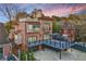 An exterior view of the home showcasing its deck, patio, roof deck, and unique architectural features at 1216 E Rock Springs Ne Rd, Atlanta, GA 30306