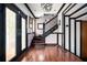 Grand foyer featuring hardwood floors, staircase, decorative molding, and ample natural light at 1216 E Rock Springs Ne Rd, Atlanta, GA 30306