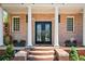 Charming brick home with porch and symmetrical landscaping enhances curb appeal at 1216 E Rock Springs Ne Rd, Atlanta, GA 30306