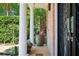 Inviting front porch with columns, featuring a large potted plant and decorative door with ironwork at 1216 E Rock Springs Ne Rd, Atlanta, GA 30306