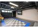 Spacious garage with rubber flooring and a door to the exterior at 1216 E Rock Springs Ne Rd, Atlanta, GA 30306