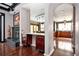 An interior view showcasing a fireplace, a kitchen counter and a glimpse into the modern kitchen at 1216 E Rock Springs Ne Rd, Atlanta, GA 30306