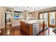 This open kitchen features stainless steel appliances, a large island, and access to the balcony at 1216 E Rock Springs Ne Rd, Atlanta, GA 30306