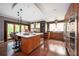 A modern kitchen with a center island, stainless steel appliances, and wood cabinets at 1216 E Rock Springs Ne Rd, Atlanta, GA 30306
