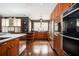 A modern kitchen featuring stainless steel appliances, wood cabinets, and marble countertops at 1216 E Rock Springs Ne Rd, Atlanta, GA 30306