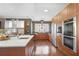 Modern kitchen featuring custom cabinets, stainless steel appliances, and hardwood floors at 1216 E Rock Springs Ne Rd, Atlanta, GA 30306